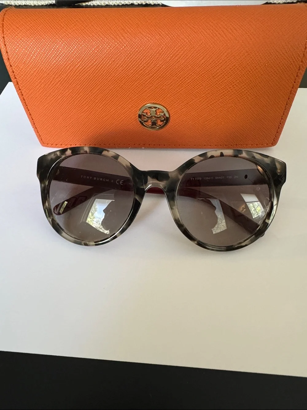 Tory Burch sunglasses.